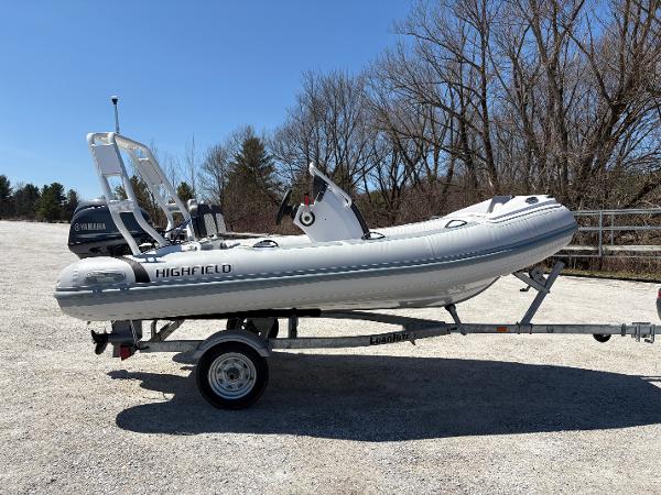 Highfield Sport 390 2024 Highfield Sport 390 boat on trailer with Yamaha engine, parked outdoors.