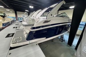 Regal 28 Express 2025 Regal 28 Express boat displayed in a showroom, showcasing sleek design and modern features.