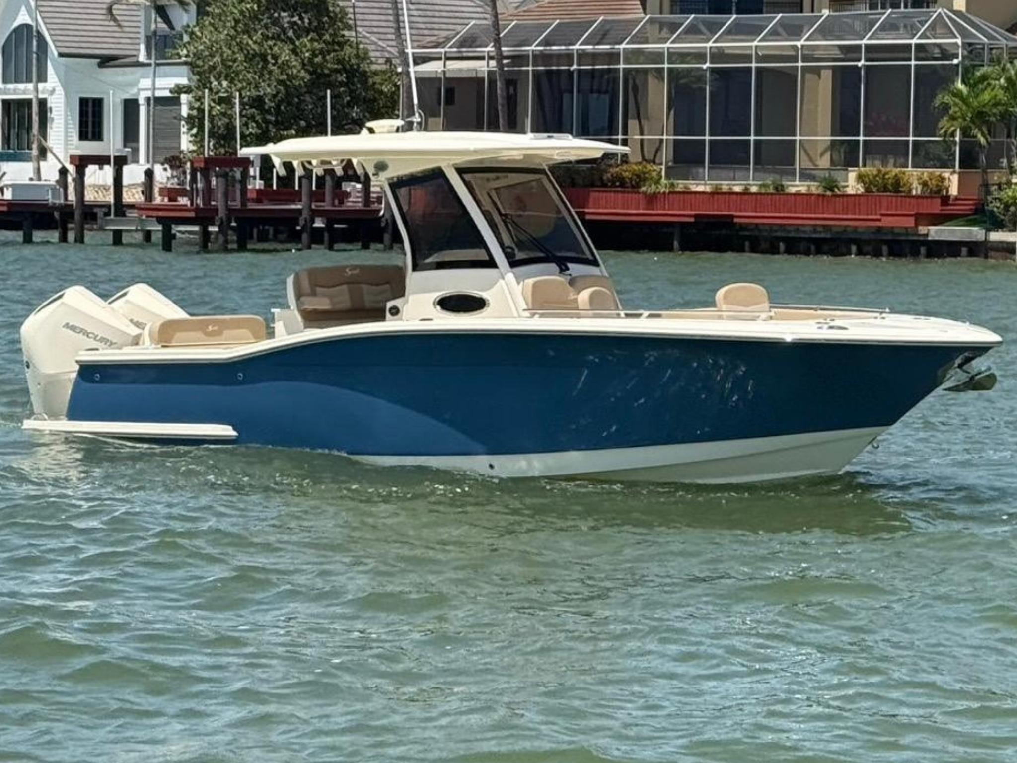 Scout 277 LXF 2023 Scout 277 LXF boat on water, featuring sleek design and modern amenities.