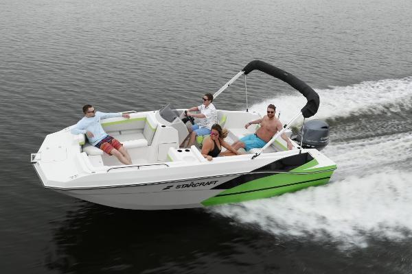 Starcraft 191 SVX 2023 Starcraft 191 SVX boat cruising with passengers on a lake.