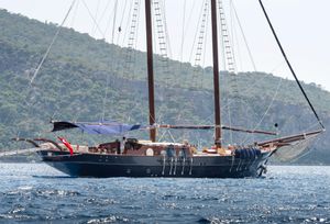 Custom Gulet Motorsailer Custom 1993 Gulet Motorsailer sailing near lush, green hills.