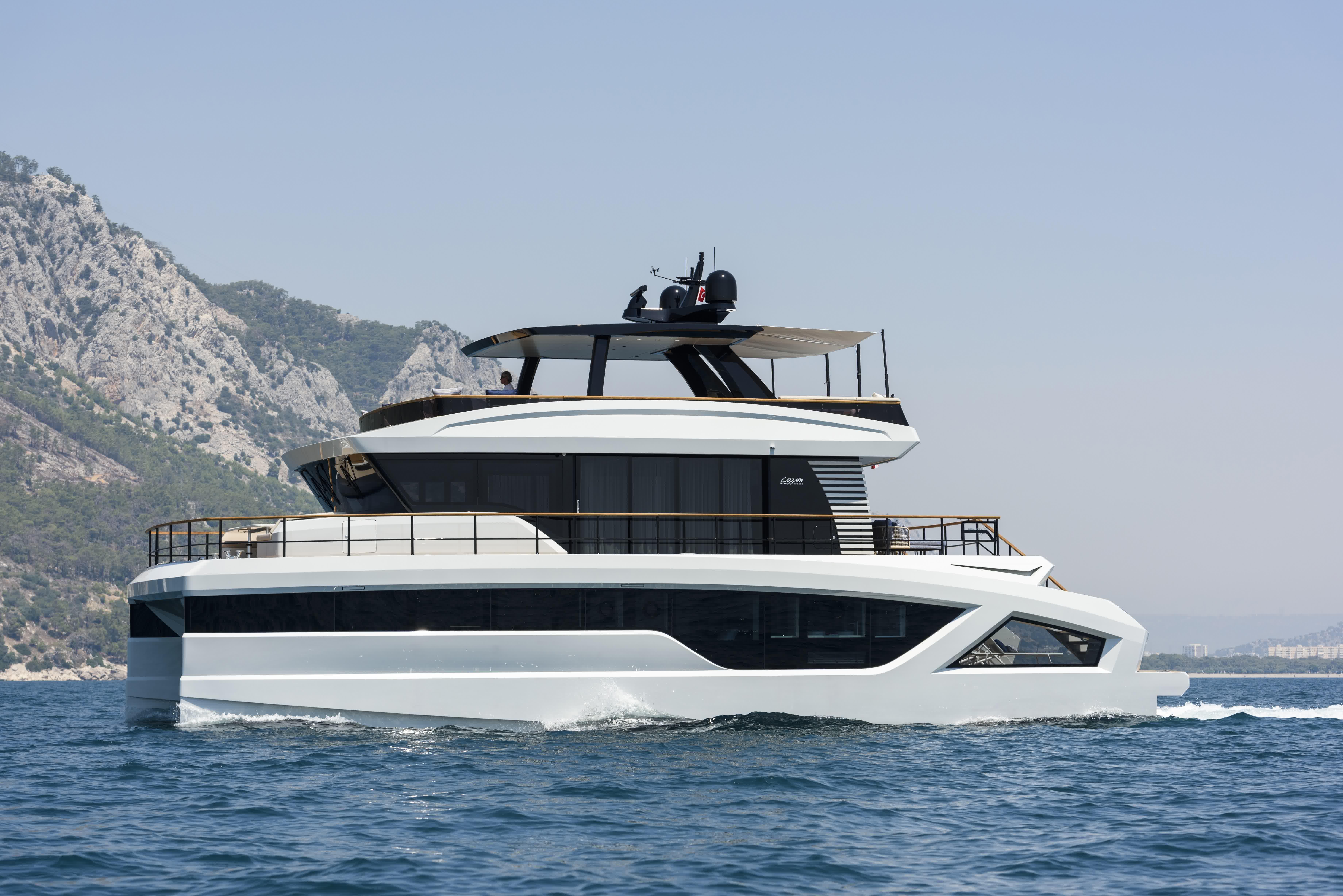 Lazzara LPC 300 Luxury Lazzara LPC 300 yacht cruising near scenic mountains, 2027 model.