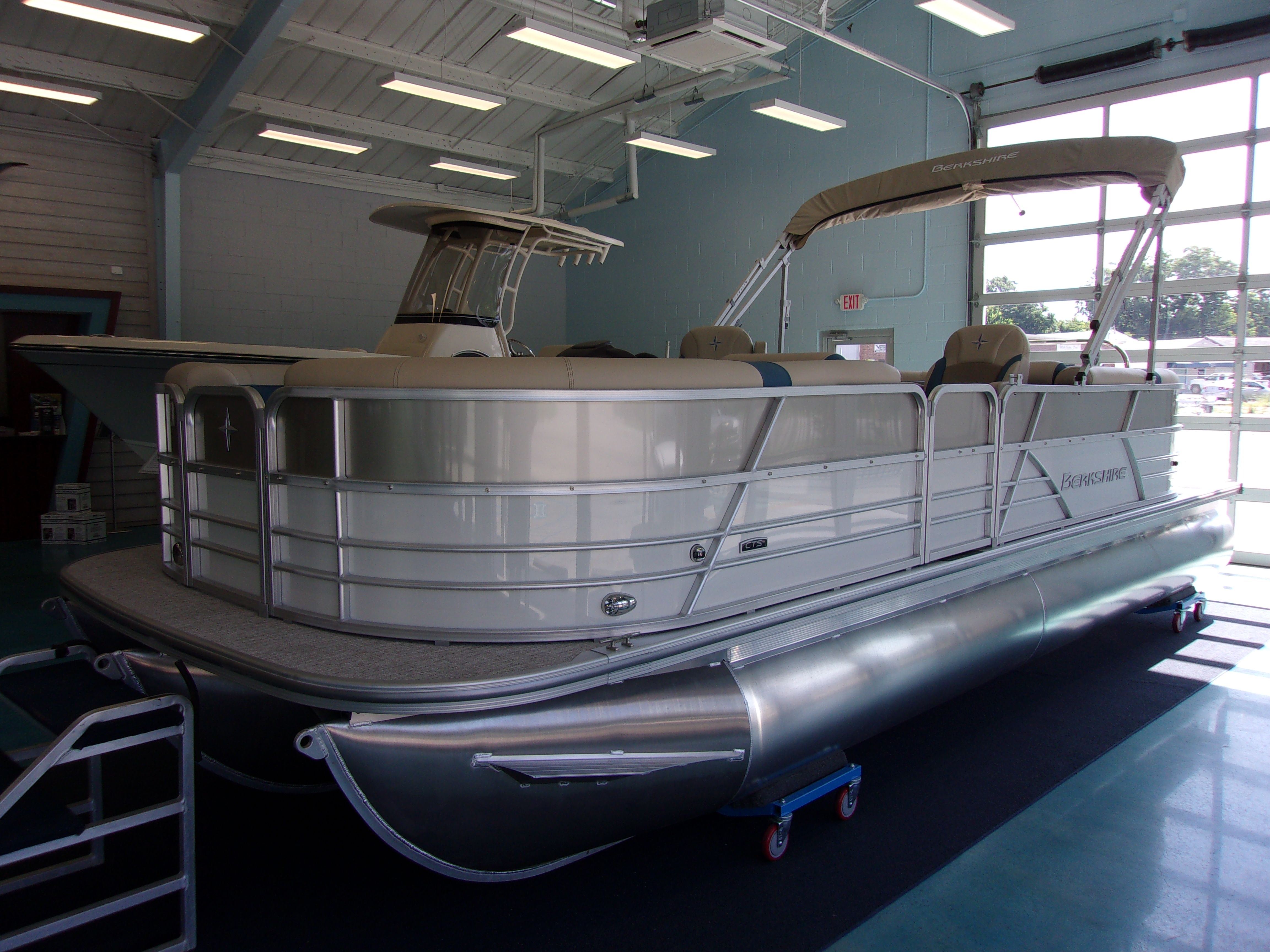 Berkshire CTS Series 24RFX CTS 2023 Berkshire CTS Series 24RFX pontoon boat displayed indoors.