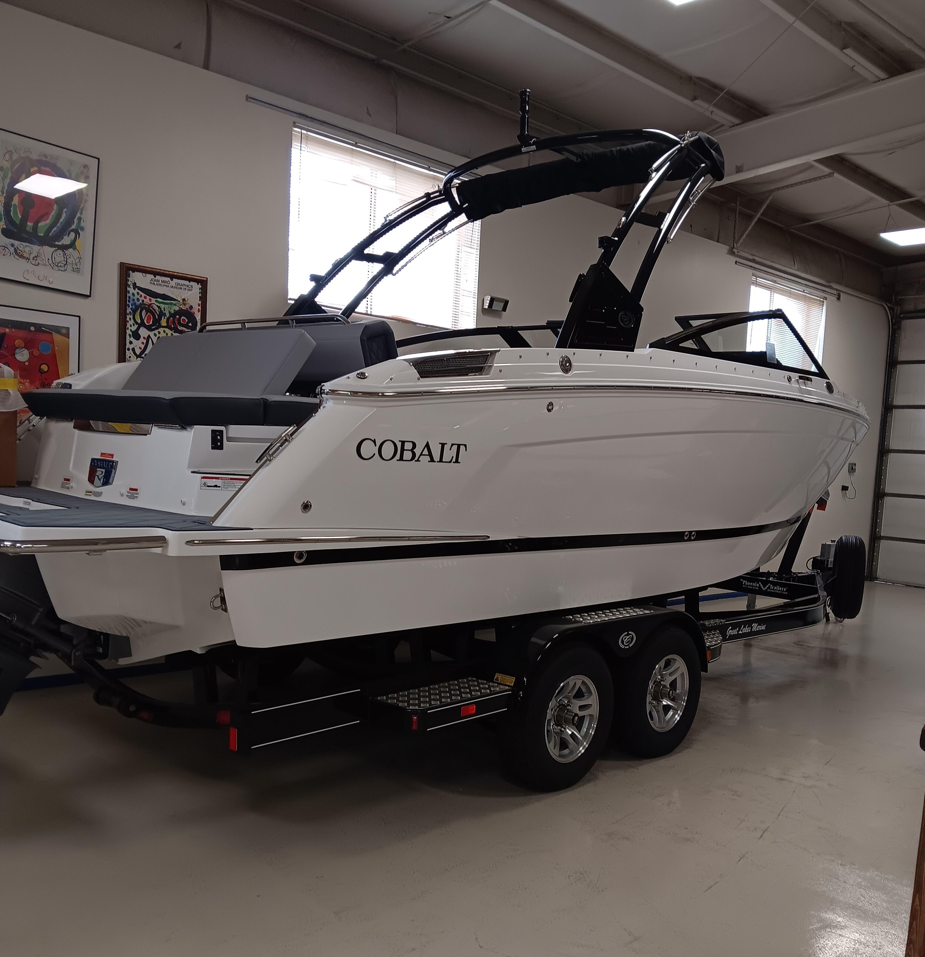 Cobalt R6 2025 Cobalt R6 boat on trailer in indoor showroom setting.