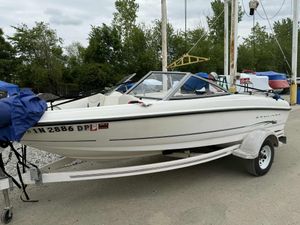 Bayliner 175 Bowrider 2005 Bayliner 175 Bowrider on trailer, parked outdoors with trees in background.