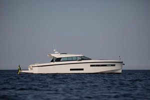 Delta Powerboats 48 Coupe 2025 Delta Powerboats 48 Coupe cruising on open water.