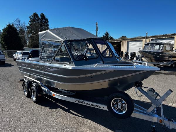 Thunder Jet 210 Luxor 2024 Thunder Jet 210 Luxor boat on EZ Loader trailer in outdoor lot.