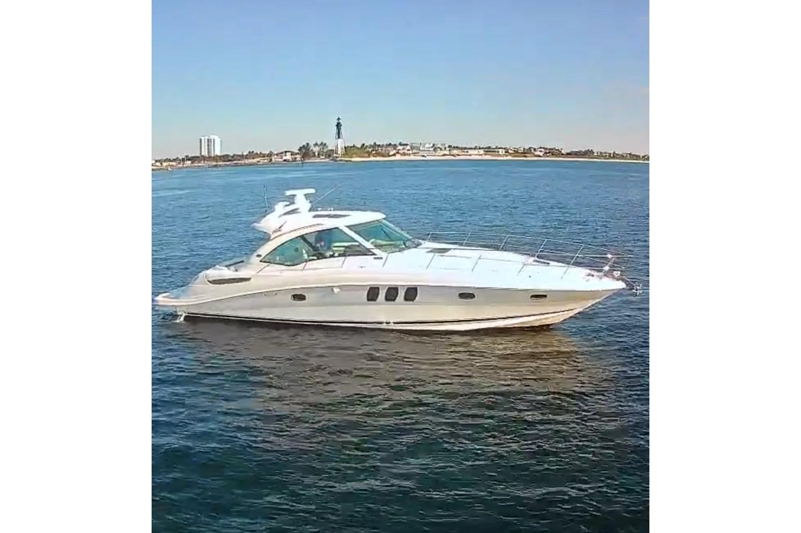 Sea Ray 48 Sundancer 2006 Sea Ray 48 Sundancer yacht cruising on calm blue waters.