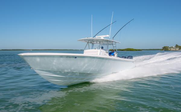 Contender 44 ST 44ST 2020 Contender 44ST boat cruising on clear blue water.