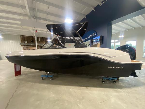 Bayliner DX2000 2024 Bayliner DX2000 boat in showroom, side view.