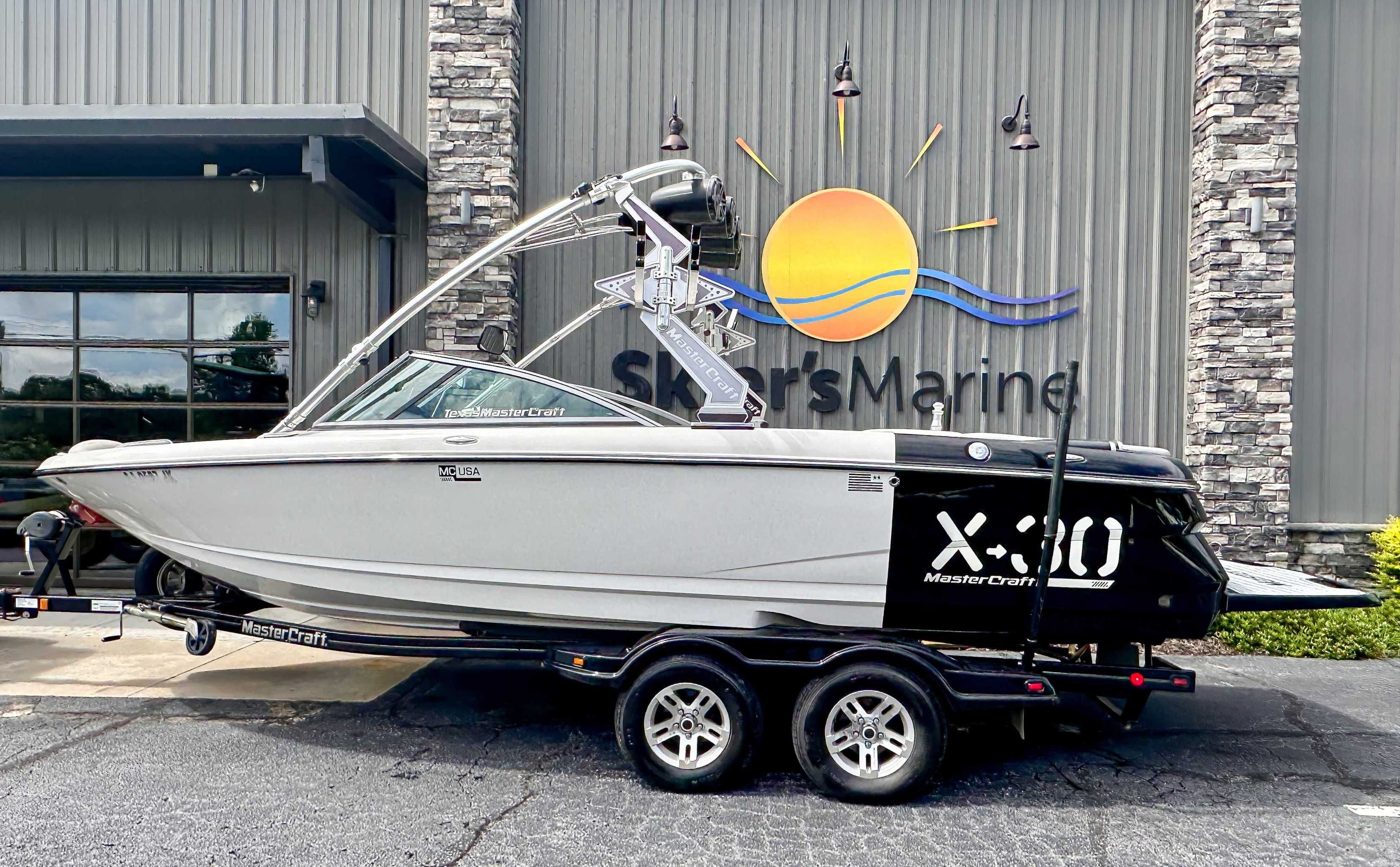 MasterCraft X30 2007 MasterCraft X30 boat on trailer outside Skier's Marine building.