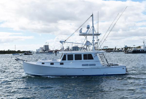 Northern Bay 38 Sportfish 2009 Northern Bay 38 Sportfish boat on water, with city skyline in background.