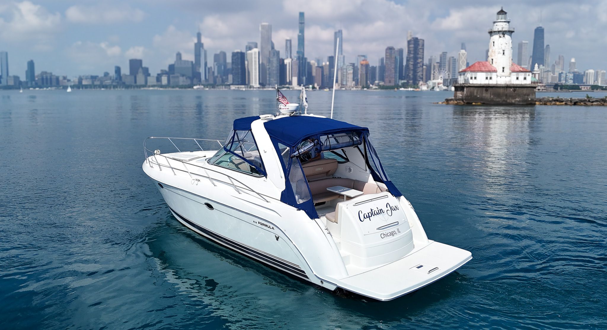 Formula 40 PC 2001 Formula 40 PC yacht cruising near Chicago skyline and lighthouse.