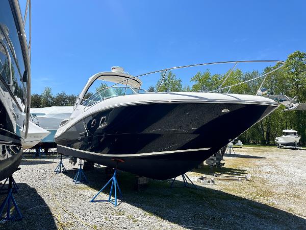 Sea Ray 330 Sundancer 2012 Sea Ray 330 Sundancer boat on stands in a sunny outdoor setting.