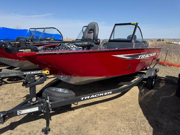 Tracker Pro Guide V-175 Combo 2025 Tracker Pro Guide V-175 Combo boat on trailer, red exterior, parked outdoors.