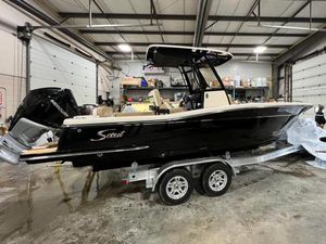 Scout 240 XSF 2022 Scout 240 XSF boat on trailer in a warehouse setting.