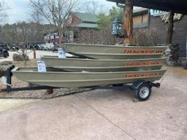 Tracker Grizzly 1236 Utility 2025 Tracker Grizzly 1236 Utility boats stacked on a trailer outdoors.