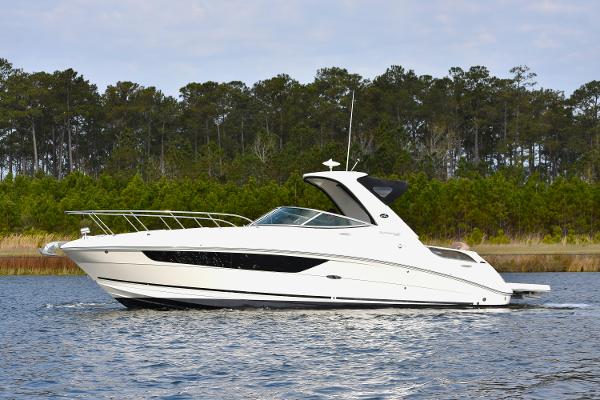 Sea Ray 310 Sundancer 2016 Sea Ray 310 Sundancer cruising on a calm lake with forested background.