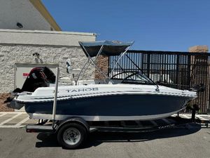 Tahoe 450 TF 2021 Tracker Tahoe 450 TF boat on trailer, parked outdoors.