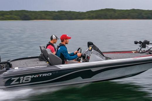 Nitro Z18 Pro Two people riding a 2026 Nitro Z18 Pro boat on a lake.