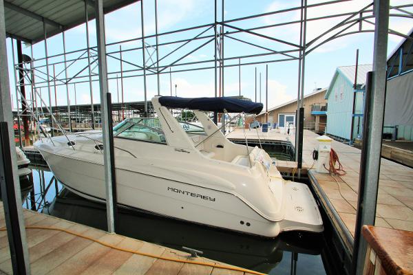 Monterey 302 Cruiser 2003 Monterey 302 Cruiser docked in a marina, featuring sleek design and white exterior.