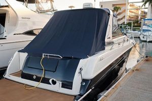 Sea Ray 290 Sundancer 1997 Sea Ray 290 Sundancer docked, covered with a navy blue tarp.