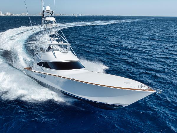 Viking Convertible 2020 Viking Convertible yacht cruising on open ocean waters.