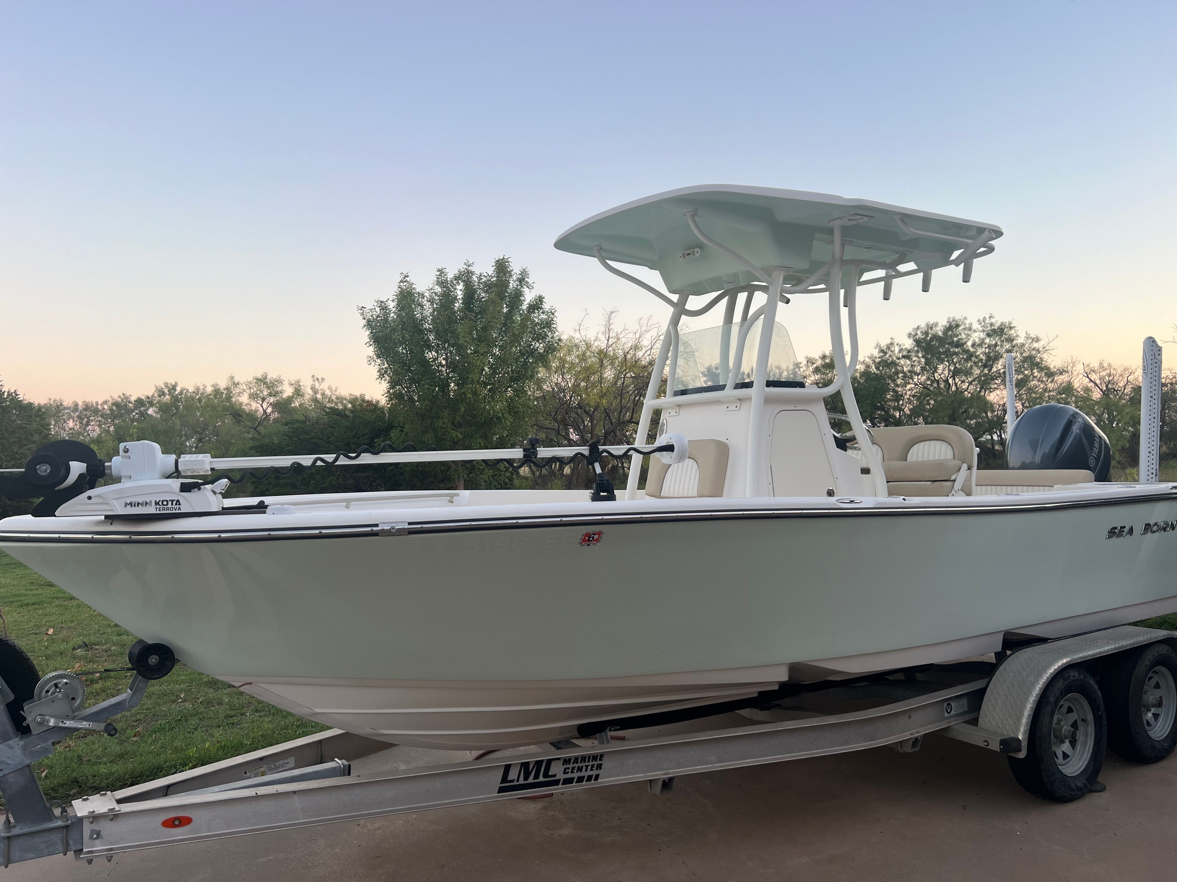 Sea Born LX21 Center Console 2018 Sea Born LX21 Center Console boat on trailer, parked outdoors at sunset.