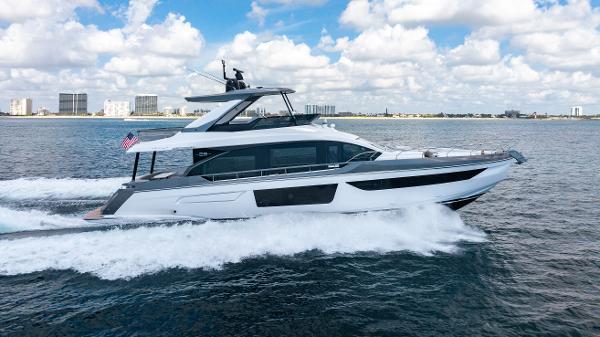 Azimut Fly 68 2023 Azimut Fly 68 yacht cruising on open water under a partly cloudy sky.