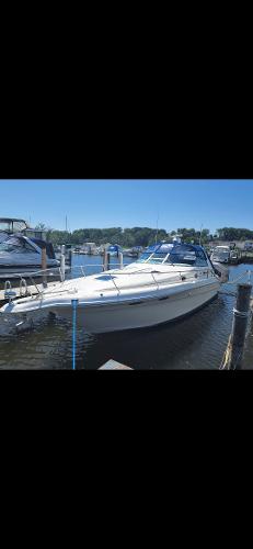 Sea Ray 330 Sundancer 1997 Sea Ray 330 Sundancer docked at a marina on a sunny day.