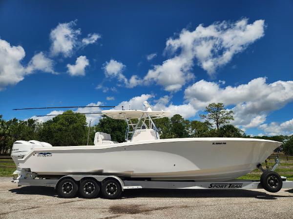 Invincible 36 Open Fisherman 2013 Invincible 36 Open Fisherman boat on trailer under blue sky.