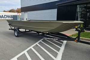 Tracker Grizzly 2072 Utility 2026 Tracker Grizzly 2072 Utility boat on trailer in parking lot.