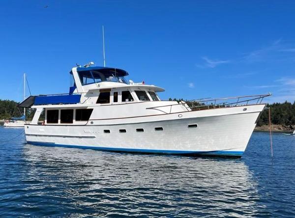 Ocean Alexander 50 MK1 1980 Ocean Alexander 50 MK1 yacht on calm water under clear blue sky.