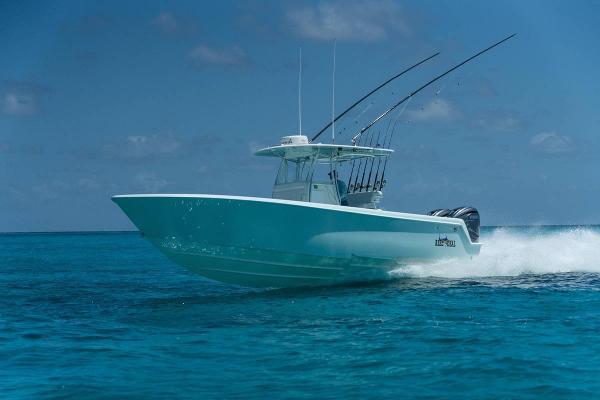 Contender 35 ST 2024 Contender 35 ST boat cruising on clear blue ocean waters.
