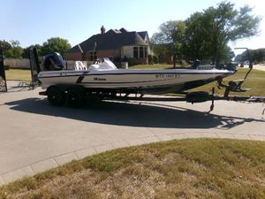 iKon LX21 2024 iKon LX21 boat on trailer in suburban driveway.