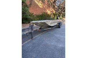 Tracker Grizzly 1756 T Marsh 2026 Tracker Grizzly 1756 T Marsh boat on trailer, parked outdoors.