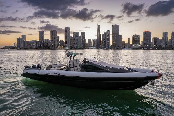 Anvera 42 Speedster Anvera 2025 Anvera 42 Speedster boat cruising near city skyline at sunset.