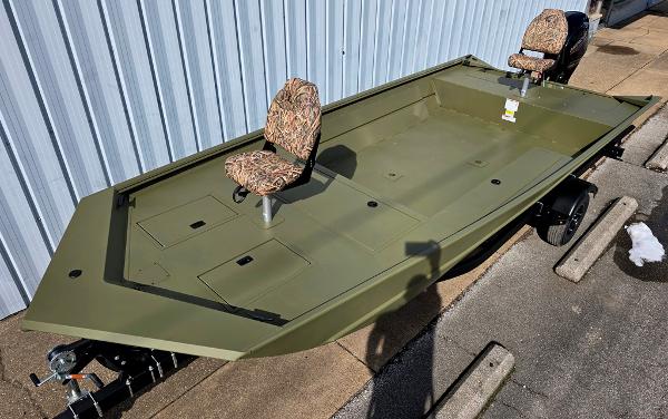 Lowe Roughneck RX2070 Tiller Steer 2025 Lowe Roughneck RX2070 Tiller Steer boat with camo seats, parked on trailer.