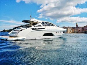 Azimut Atlantis 58 Azimut Atlantis 58 yacht, 2012 model, cruising on calm waters near coastal buildings.