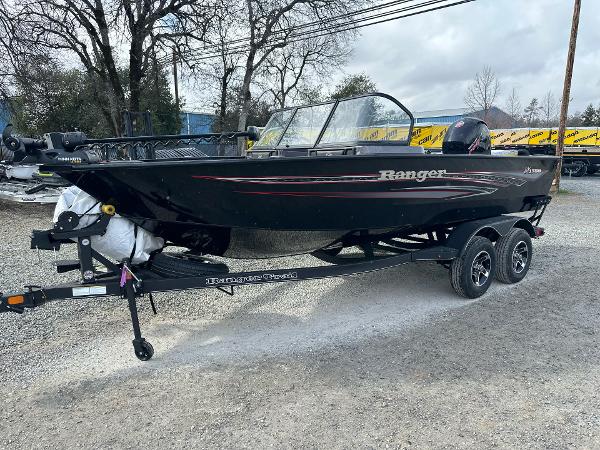 Ranger VX1788 WT 2023 Ranger VX1788 WT boat on trailer, parked outdoors, black with red accents.