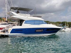 Prestige 460 2022 Prestige 460 yacht docked in marina, featuring sleek design and modern amenities.