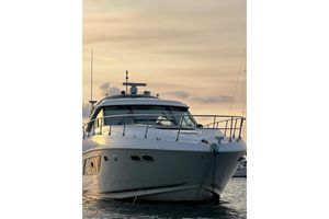 Sea Ray 540 Sundancer 2014 Sea Ray 540 Sundancer yacht at sunset on calm waters.