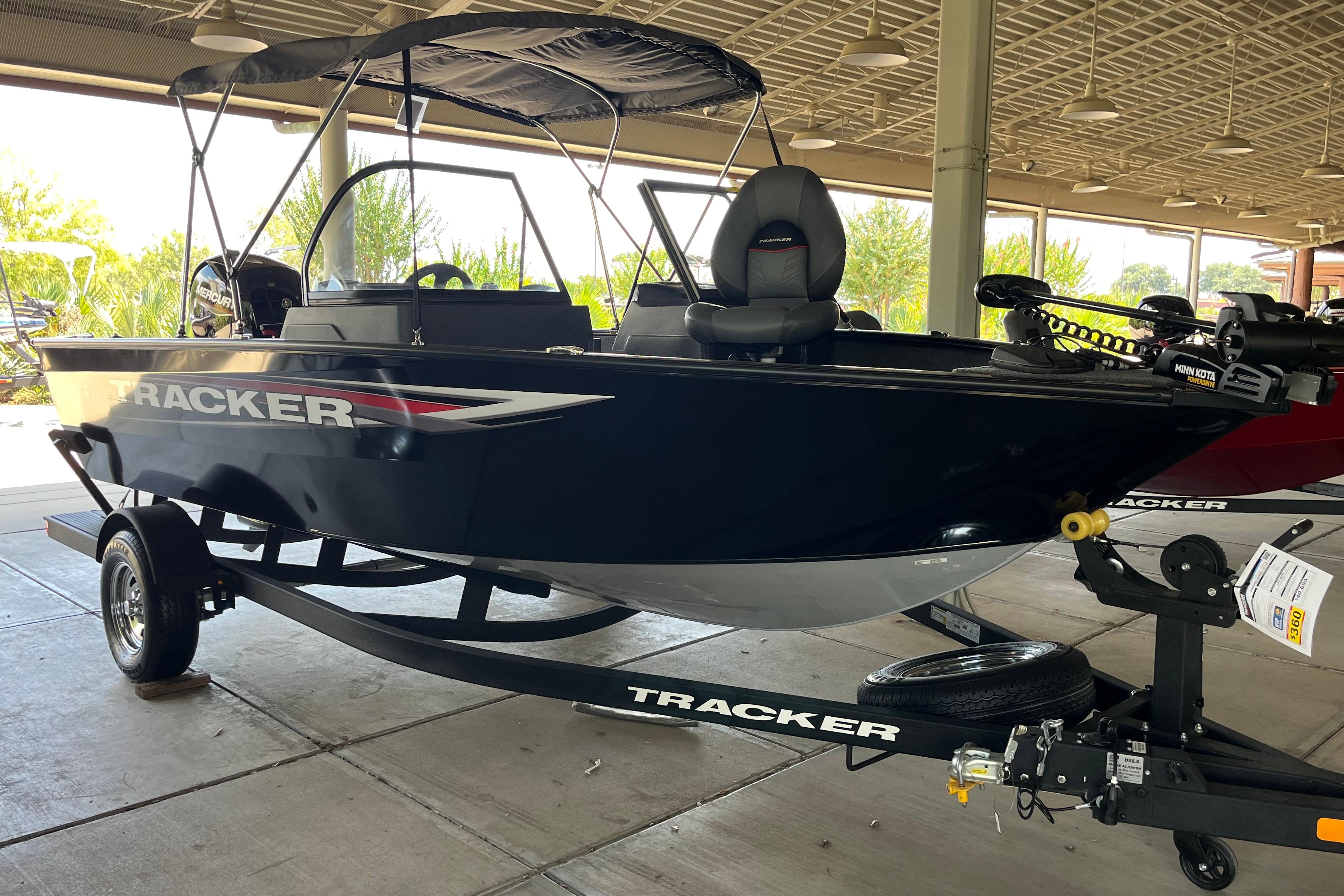 Tracker Pro Guide V-175 Combo 2025 Tracker Pro Guide V-175 Combo boat on trailer in covered area.