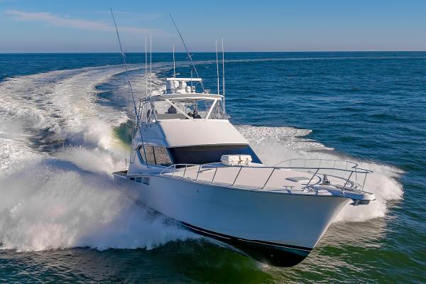 Hatteras 60 Convertible 2005 Hatteras 60 Convertible yacht cruising on open sea.