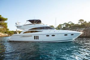 Princess 58 Luxury 2008 Princess 58 yacht on serene water, surrounded by lush greenery.