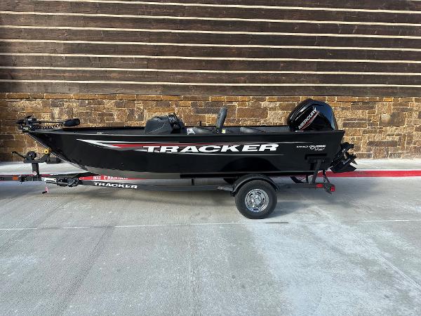 Tracker Pro Guide V-16 SC 2025 Tracker Pro Guide V-16 SC boat on trailer, black exterior, parked outdoors.