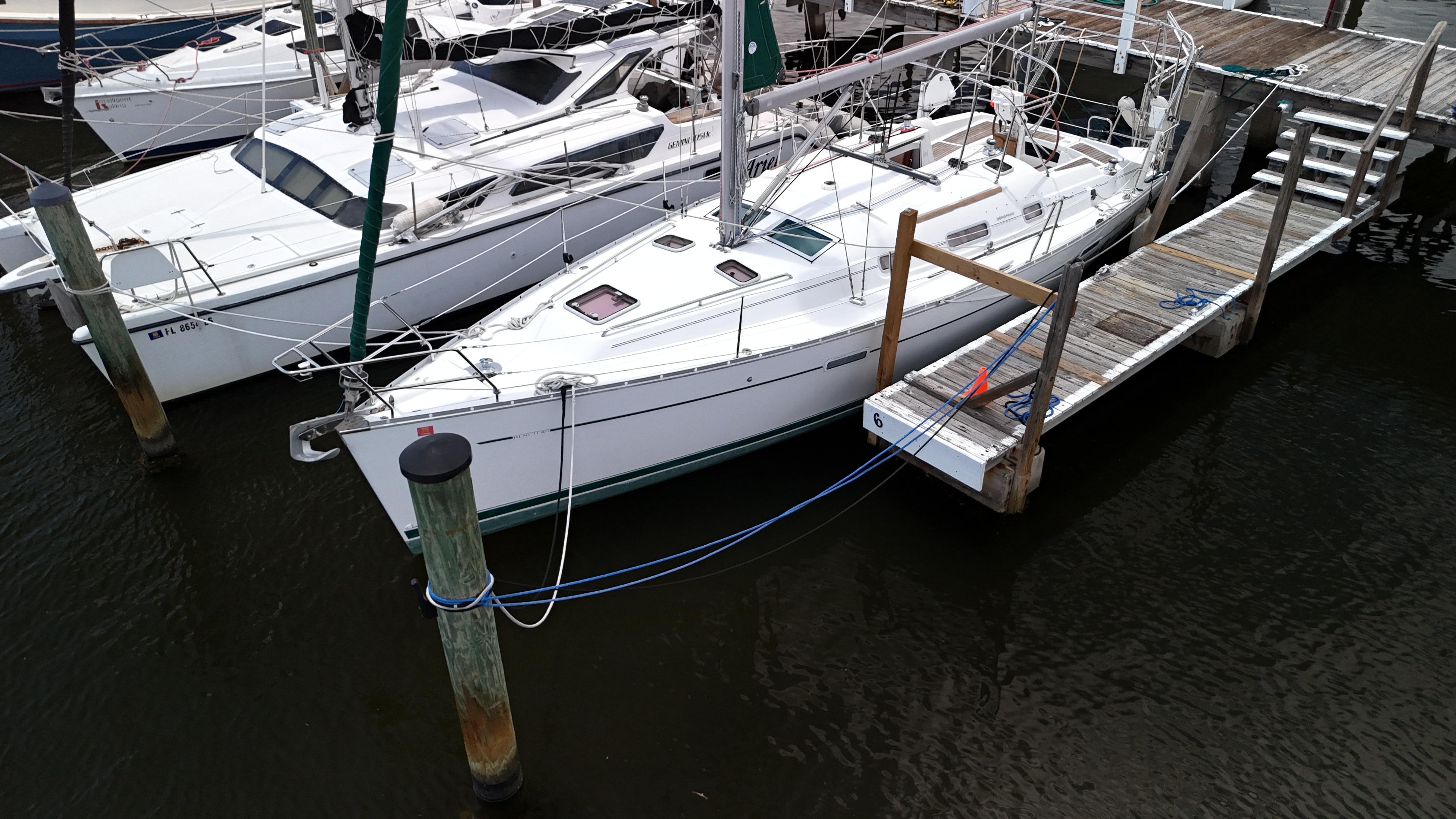 Beneteau 343 2007 Beneteau 343 sailboat docked at marina, side view.