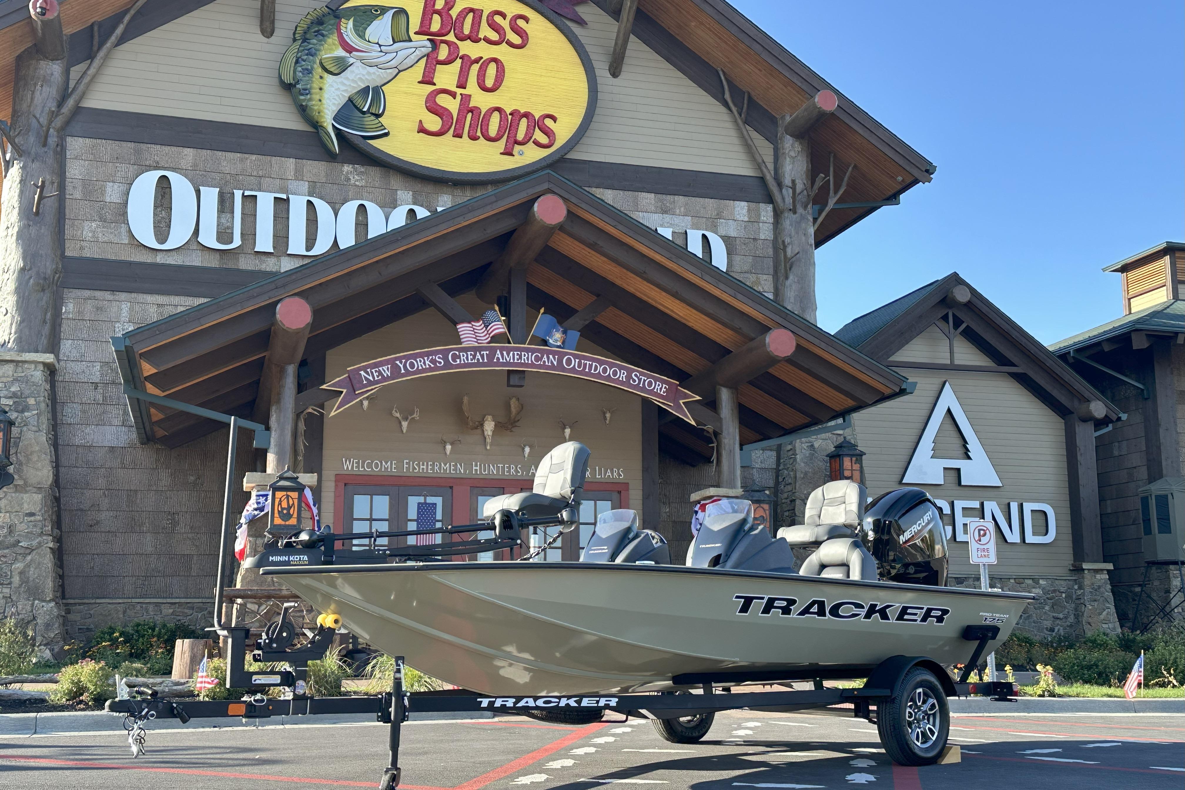 Tracker Pro Team 175 2026 Tracker Pro Team 175 boat displayed outside Bass Pro Shops store.