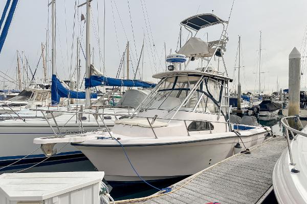 Grady-White Sailfish 282 2007 Grady-White Sailfish 282 boat docked at marina with other vessels.