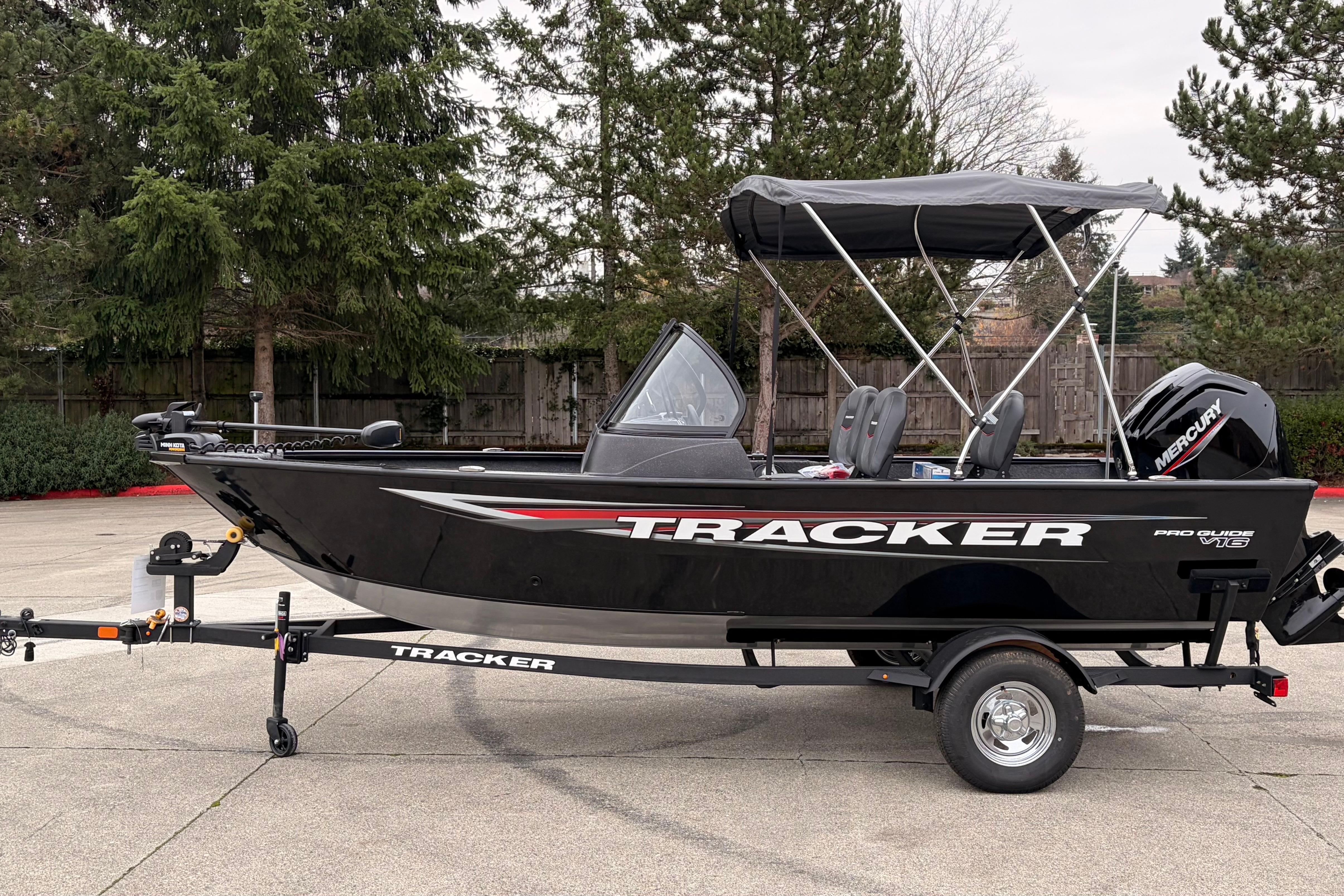 Tracker Pro Guide V-16 WT 2026 Tracker Pro Guide V-16 WT boat on trailer, parked outdoors.